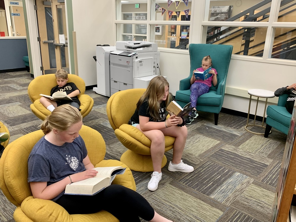 students reading in the library