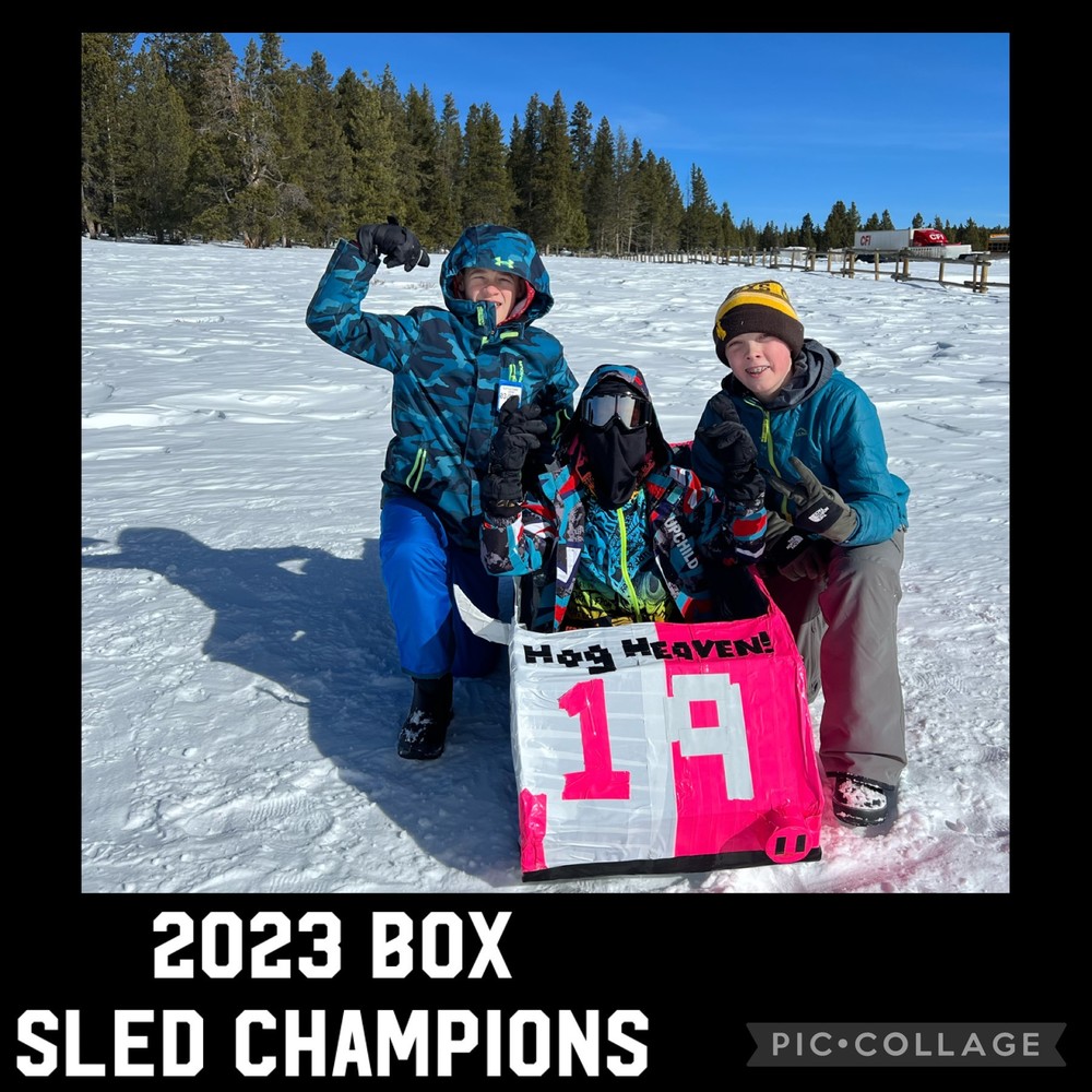 3 boys with sled